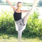 young female dancer showing ballet pose